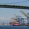 Los Angeles, CA, USA - Mar 27, 2023: ONE Henry Hudson, a container ship sailing under the flag of Panama, is docked at the Yusen Container Terminal in the Port of Los Angeles on Terminal Island.