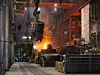 Steelmaker at ingot casting. Electric arc furnace shop EAF. Metallurgy.