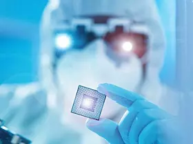 African-American scientist works in a modern scientific laboratory for the research and development of microelectronics and processors. Manufacturing worker uses computer technology and equipment.