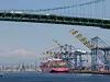 Los Angeles, CA, USA - Mar 27, 2023: ONE Henry Hudson, a container ship sailing under the flag of Panama, is docked at the Yusen Container Terminal in the Port of Los Angeles on Terminal Island.
