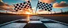 Checkered Finish Line Flags at Sunset on a Race Track