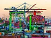 Long Beach, California - January 15, 2025: Colorful Cranes and Cargo Ship at Long Beach Port