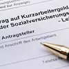 Antrag auf Kurzarbeitergeld mit Kugelschreiber
